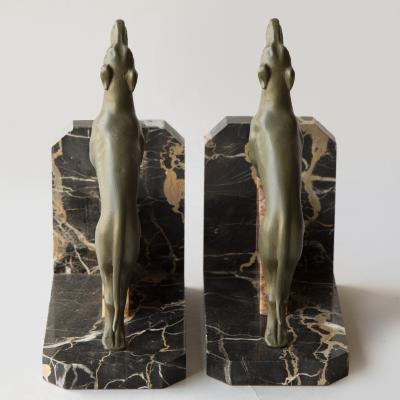 A PAIR OF LIMOUSIN PAINTED SPELTER SIGHTHOUND BOOKENDS