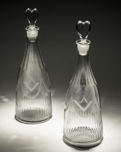 A PAIR OF MASONIC TAPERED DECANTERS