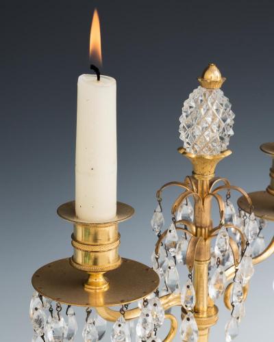 A PAIR OF ORMOLU AND GLASS TEMPLE CANDELABRA