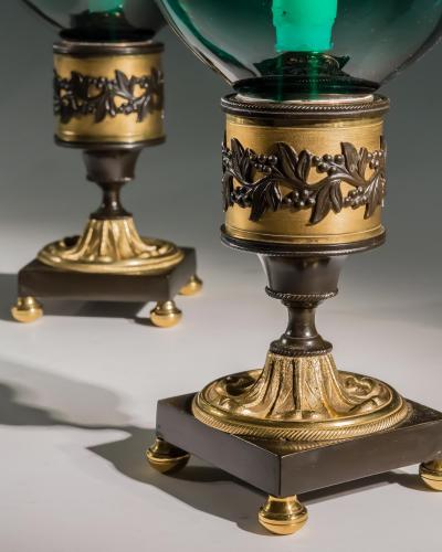 A PAIR OF ORMOLU BRONZE MOUNTED GREEN STORM SHADES