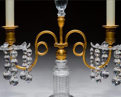 A PAIR OF ORMOLU GLASS REGENCY CANDELABRA