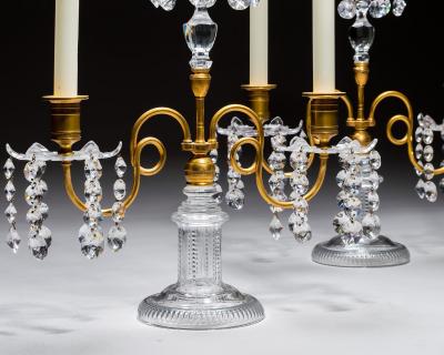 A PAIR OF ORMOLU GLASS REGENCY CANDELABRA