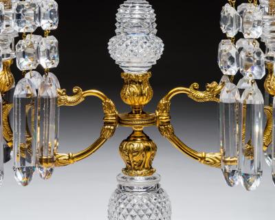 A PAIR OF ORNATE REGENCY CANDELABRA