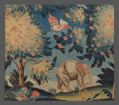 A PAIR OF PETIT POINT NEEDLEWORK PICTURES DEPICTING AN ELEPHANT AND A CAMEL
