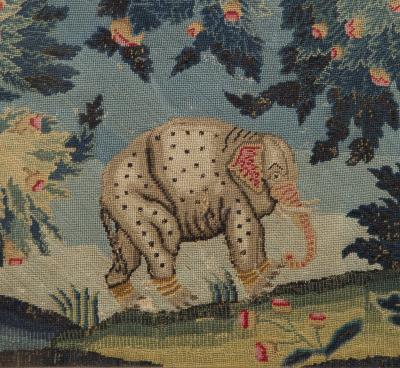 A PAIR OF PETIT POINT NEEDLEWORK PICTURES DEPICTING AN ELEPHANT AND A CAMEL