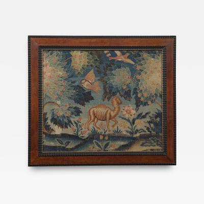 A PAIR OF PETIT POINT NEEDLEWORK PICTURES DEPICTING AN ELEPHANT AND A CAMEL