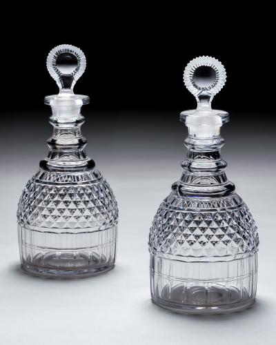 A PAIR OF REGENCY CUT GLASS DECANTERS
