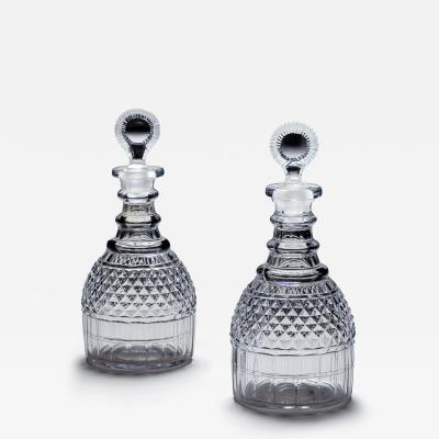 A PAIR OF REGENCY CUT GLASS DECANTERS