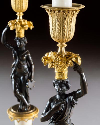 A PAIR OF REGENCY FIGURE CANDLESTICKS