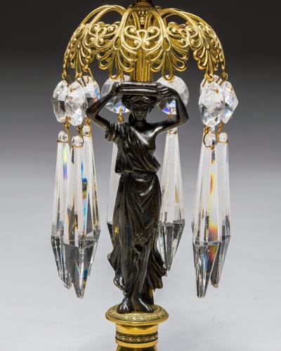 A PAIR OF REGENCY GILT BRONZE FIGURE CANDLESTICKS