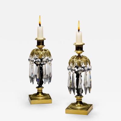 A PAIR OF REGENCY GILT BRONZE FIGURE CANDLESTICKS