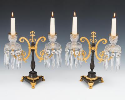 A PAIR OF REGENCY ORMOLU AND BRONZE CUT GLASS CANDELABRA