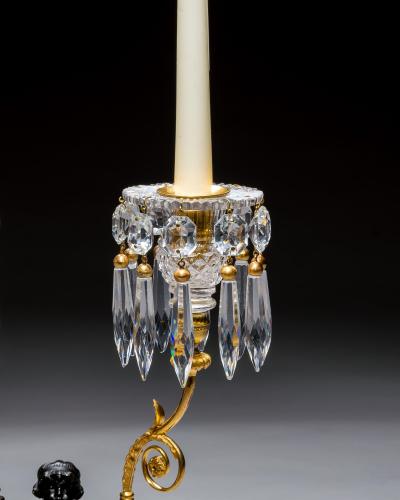 A PAIR OF REGENCY ORMOLU BRONZE BOY CANDELABRA