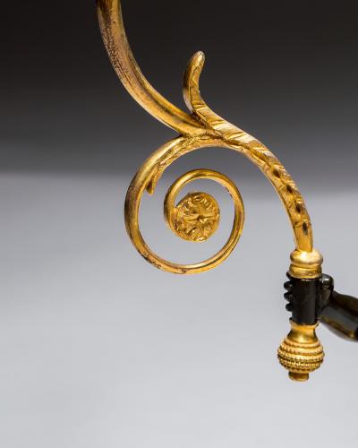 A PAIR OF REGENCY ORMOLU BRONZE BOY CANDELABRA