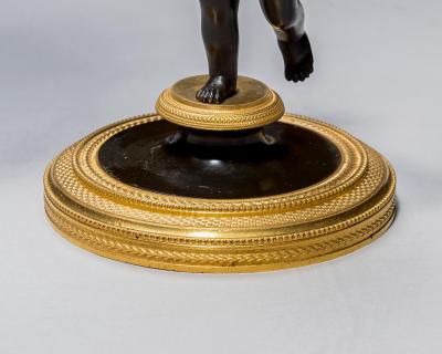 A PAIR OF REGENCY ORMOLU BRONZE BOY CANDELABRA