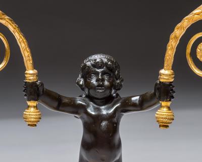 A PAIR OF REGENCY ORMOLU BRONZE BOY CANDELABRA