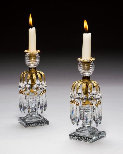 A PAIR OF REGENCY ORMOLU GLASS CANDLESTICKS