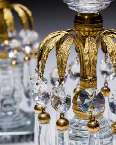 A PAIR OF REGENCY ORMOLU GLASS CANDLESTICKS