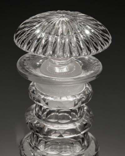 A PAIR OF REGENCY SLICE FLUTE DECANTERS WITH DIAMOND CUT BAND