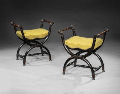 A PAIR OF REGENCY X FRAMED OAK EBONISED WINDOW SEATS