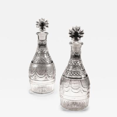 A PAIR OF RICHLY CUT REGENCY SPIRIT DECANTERS