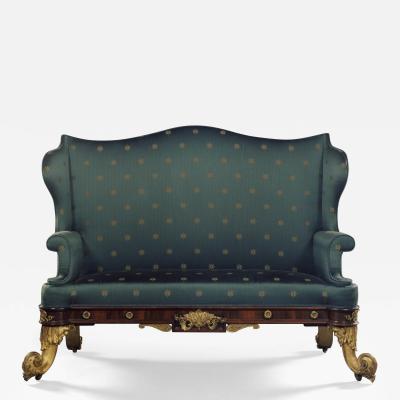 A PAIR OF ROSEWOOD SOFAS IN THE ANTIQUARIAN TASTE MOST UNUSUALLY SET