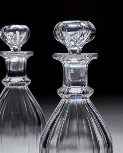 A PAIR OF SLICE CUT WILLIAM IV CLUB DECANTERS