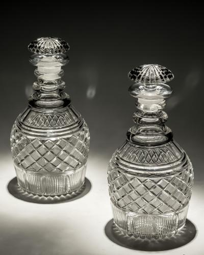 A PAIR OF STRAWBERRY DIAMOND CUT GEORGIAN DECANTERS