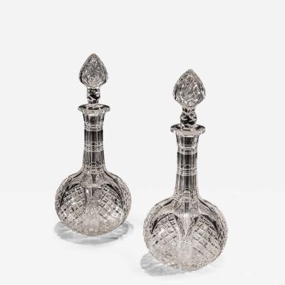 A PAIR OF VICTORIAN DECANTERS CUT WITH TULIP PETALS CROSS OVER DIAMONDS