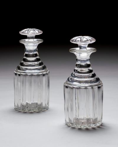 A PAIR OF WILLIAM IV PILLAR CUT DECANTERS