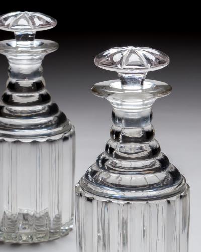 A PAIR OF WILLIAM IV PILLAR CUT DECANTERS