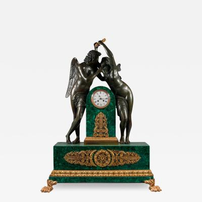 A PALATIAL PATINATED BRONZE MALACHITE MANTEL CLOCK OF CUPID AND PSYCHE