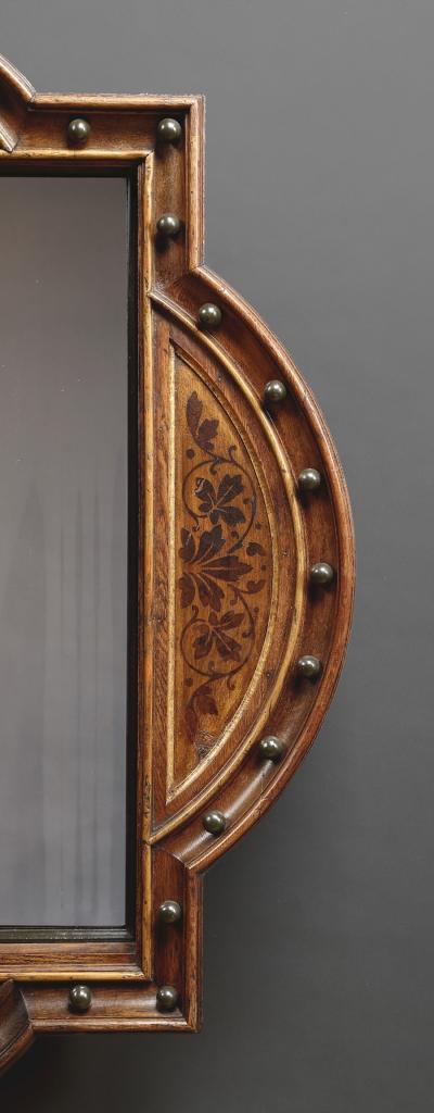 A Pair Of Neo Gothic Oak Walnut And Painted Mirrors Of Interesting Form