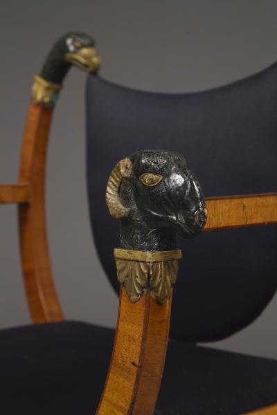 A Pair Of Neoclassical X Form Armchairs With Parcel Gilt And Bronzed Detailing