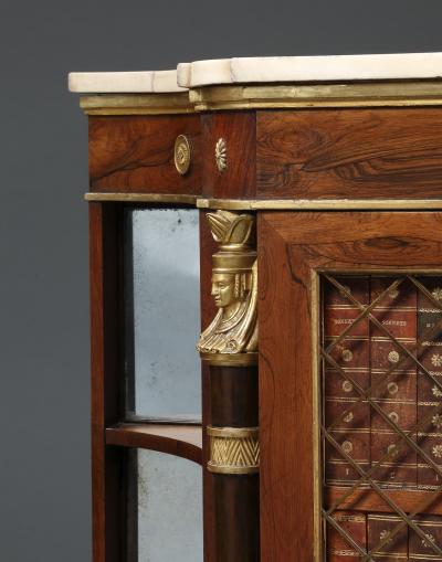 A Pair Of Regency Library Cabinets With Giltwood Detailing And Faux Book Panels