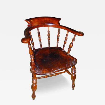 A Pair of 19th Century Similar English Windsor Captain s Chairs