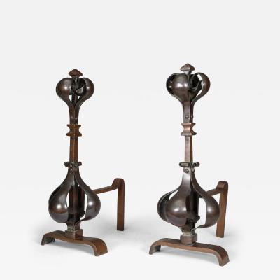 A Pair of Arts Crafts Copper Bronze Fire Dogs with Pyramid Style Finials