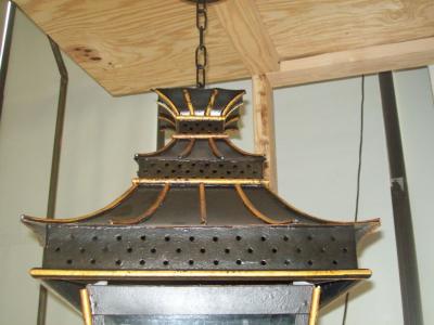 A Pair of Asian Inspired Tole Painted Lanterns