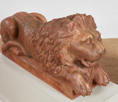 A Pair of Cast Iron Recumbent Lions