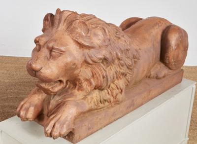 A Pair of Cast Iron Recumbent Lions