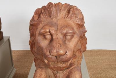 A Pair of Cast Iron Recumbent Lions