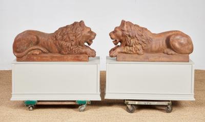 A Pair of Cast Iron Recumbent Lions
