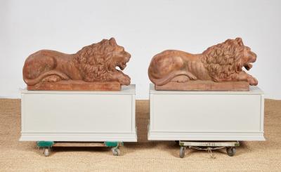 A Pair of Cast Iron Recumbent Lions