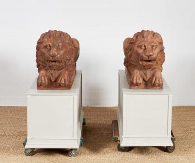 A Pair of Cast Iron Recumbent Lions