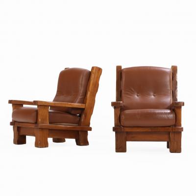 A Pair of French Heavy Oak Brutalist style Open Arm Chairs C 1960 