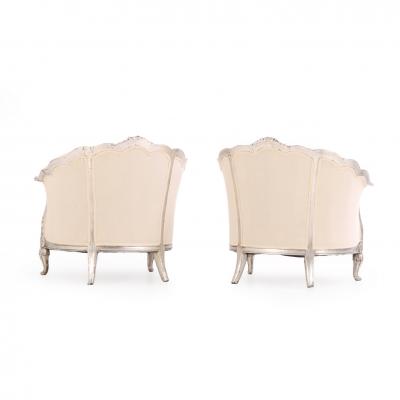 A Pair of French Louis XV style silver leaf lounge chairs C 1930 