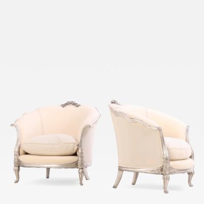 A Pair of French Louis XV style silver leaf lounge chairs C 1930 