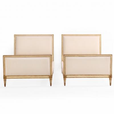 A Pair of French Louis XVI style Painted and Gilt Twin Beds C 1940 