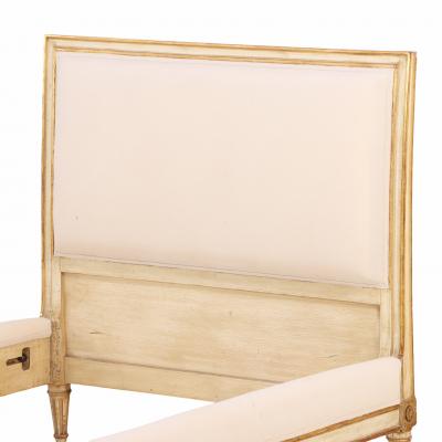 A Pair of French Louis XVI style Painted and Gilt Twin Beds C 1940 