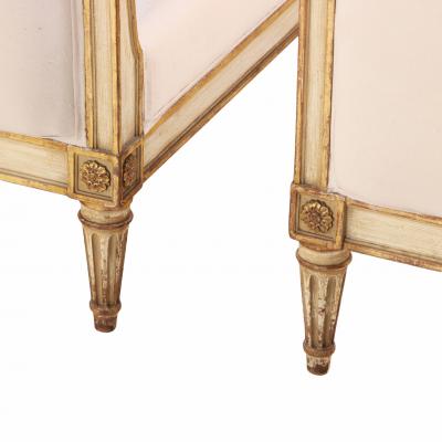 A Pair of French Louis XVI style Painted and Gilt Twin Beds C 1940 